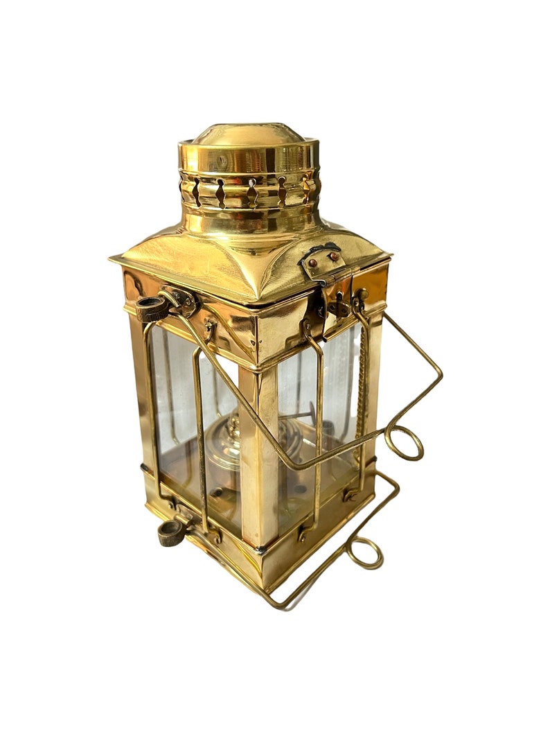 Nautical hanging oil lamp made of brass and glass, perfect for coastal decor