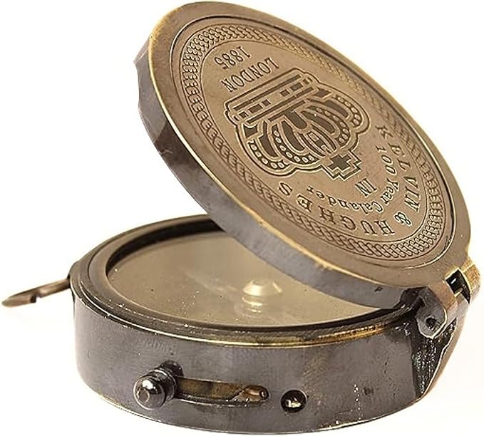 Open view of brass compass showing magnetic needle and internal details