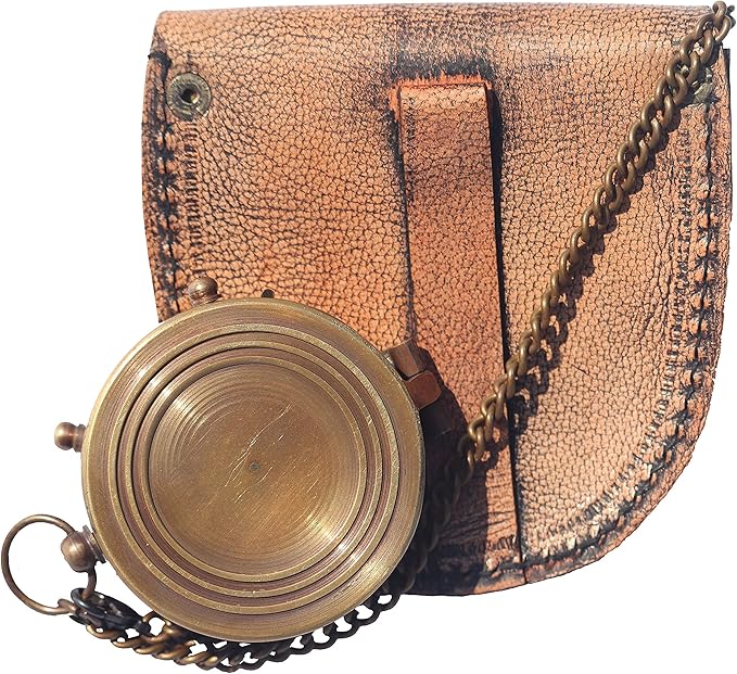 Close-up of the compass showing premium brass finish and inspirational engraved details.