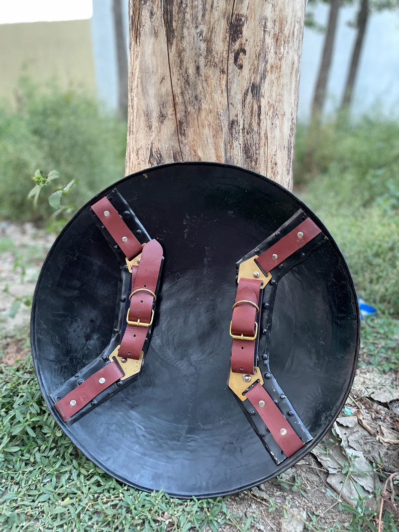 Back view of cosplay shield showing leather grip and straps