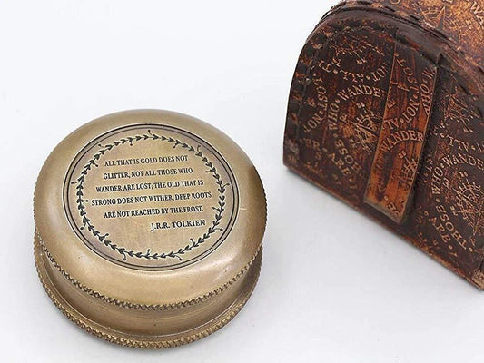 Close-up showing engraved quote “Not all who wander are lost” on RII brass compass
