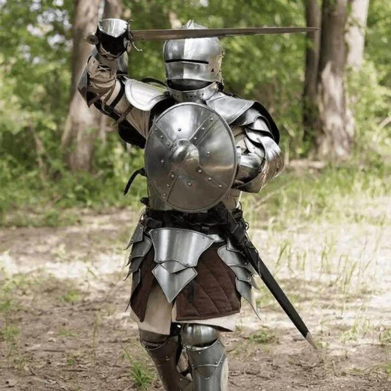 Front view of the Rikomer Steel Full Body Armor Suit with helmet, chestplate, and tassets, showcasing full medieval detailing.