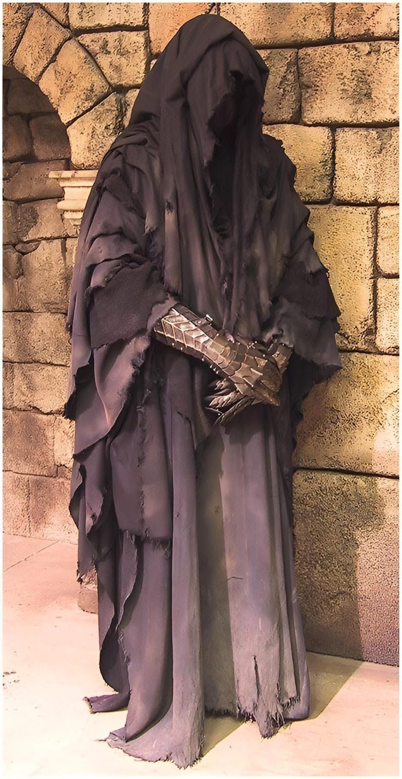 Close-up of the blackened steel Nazgûl helmet with shadowy visor, designed to mimic the faceless terror of the Ringwraiths.