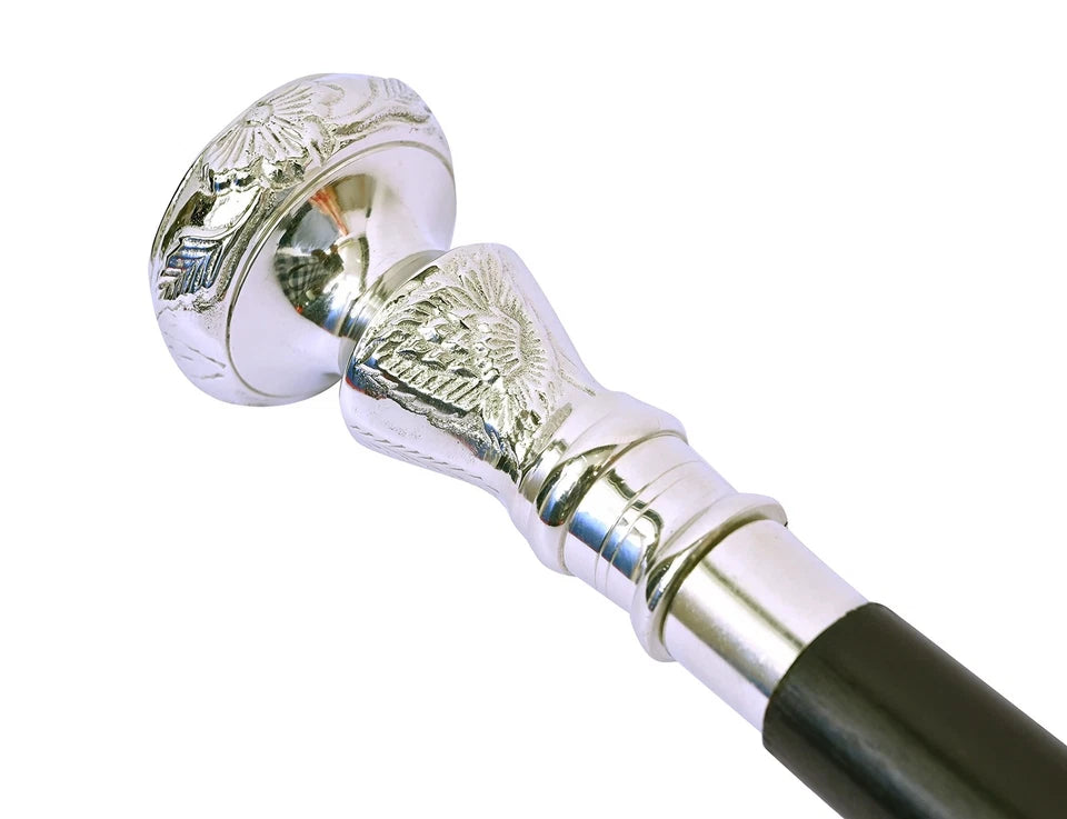 Close-up of the silver brass handle cane with nautical design details