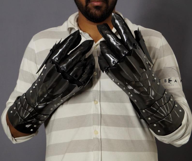 Medieval-style spiked pauldrons forged in blackened steel, part of the Nazgûl cosplay set inspired by The Lord of the Rings.