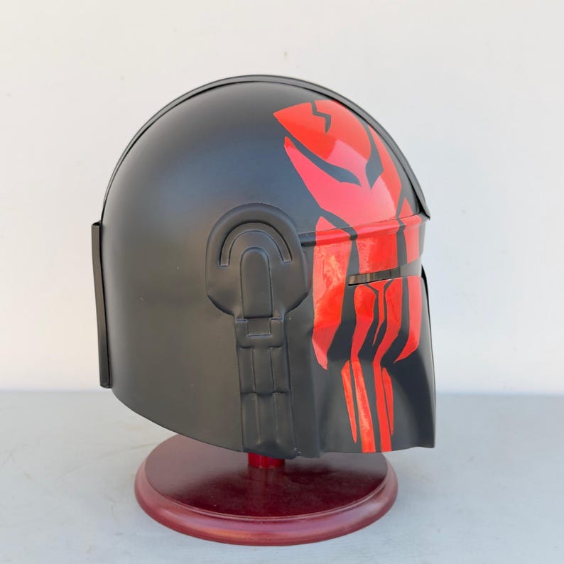 Back view of Star Wars Mandalorian prop helmet in black and red steel for sci-fi displays