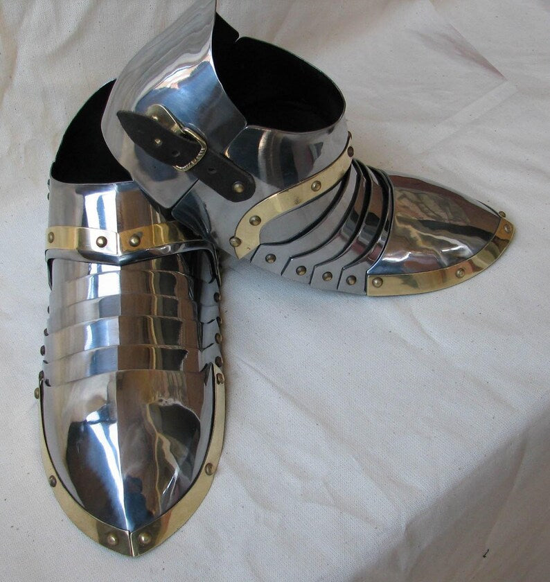 Bottom view of steel brass sabatons featuring genuine leather straps for secure fit