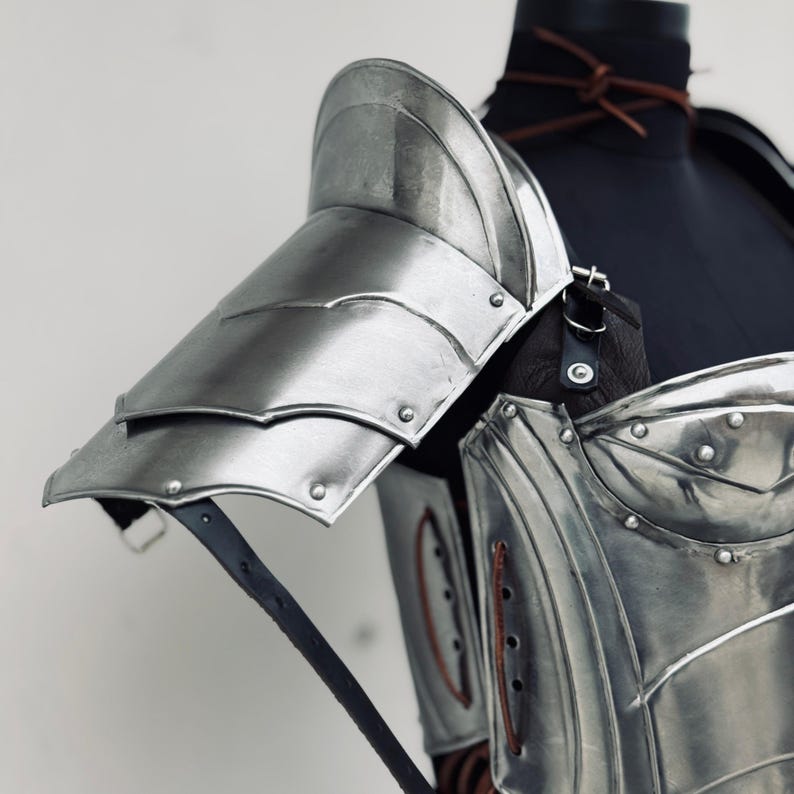 Cosplay-ready steel medieval female armor suit including cuirass, bracers, and pauldrons.