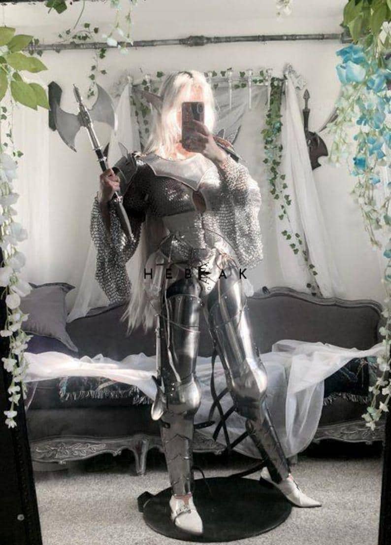 Side angle of the Royal Valkyrie armor showing articulated pauldrons, layered chainmail, and full arm protection in authentic medieval style.