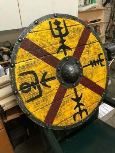 Viking shield being used in cosplay or historical reenactment, showcasing its realistic battle-worn design.