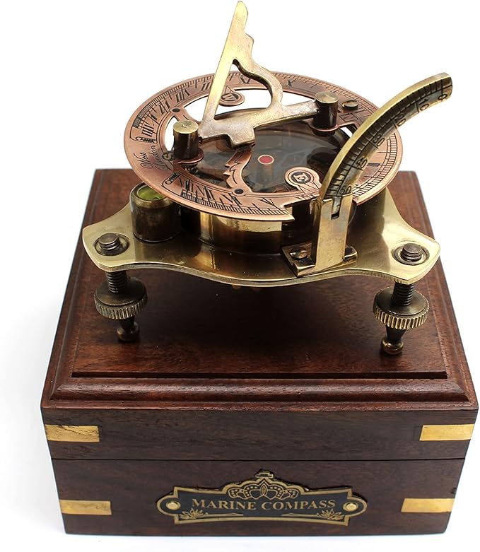 Front view of vintage brass sundial compass with WEST London engraving