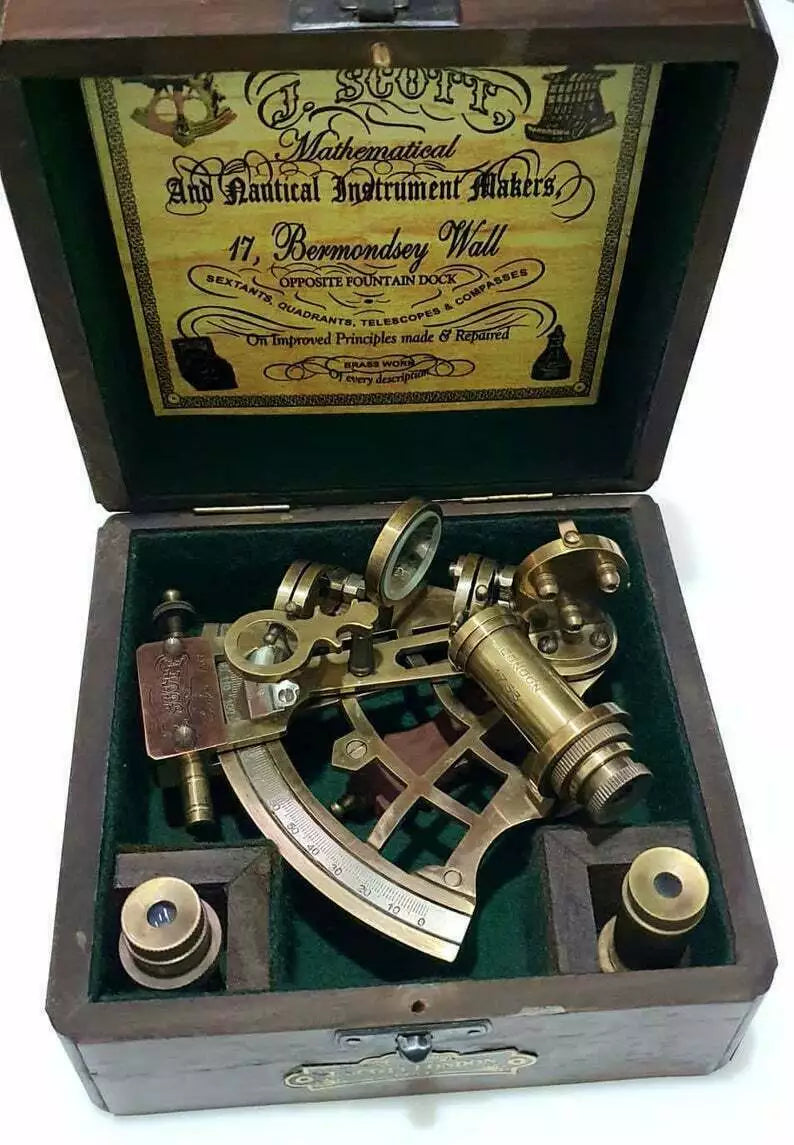 Vintage maritime brass sextant with engraved wooden display and storage box