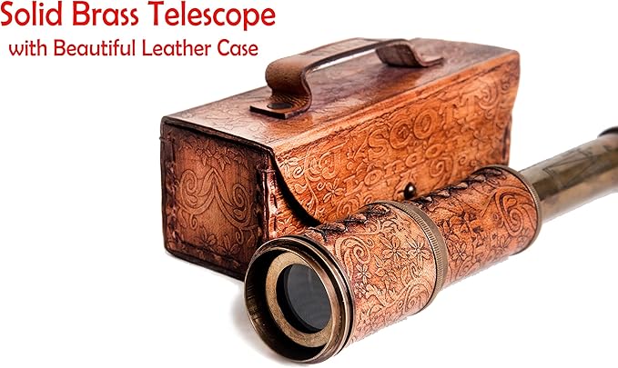 Vintage nautical spyglass with hand-stitched leather case on wooden table