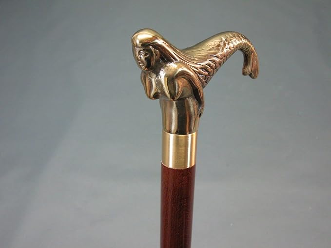 Vintage style walking stick featuring decorative brass handle, 36 inches long