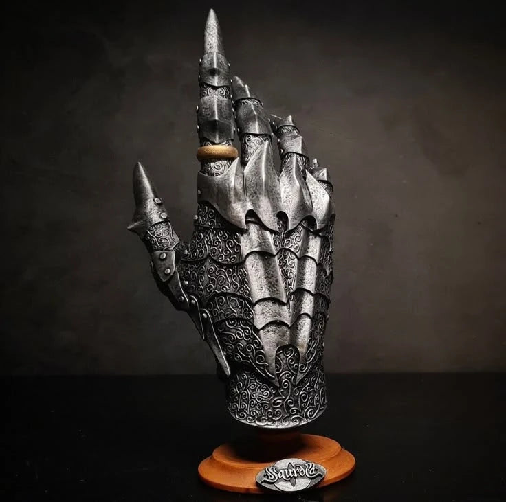 Handcrafted medieval gloves made from leather and metal, perfect for reenactments and cosplay