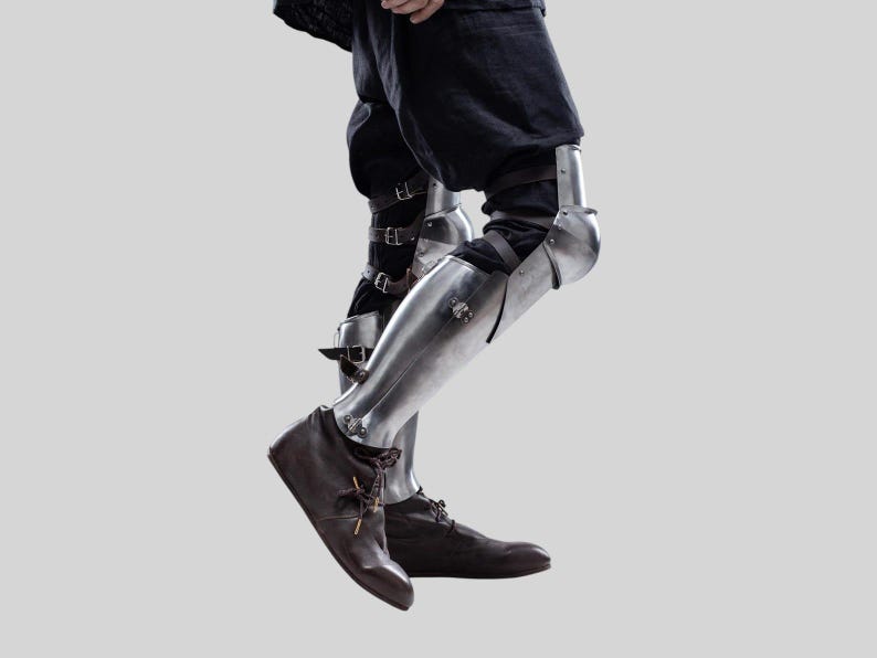 Side view of adjustable shin guards with genuine leather straps for medieval knight costume