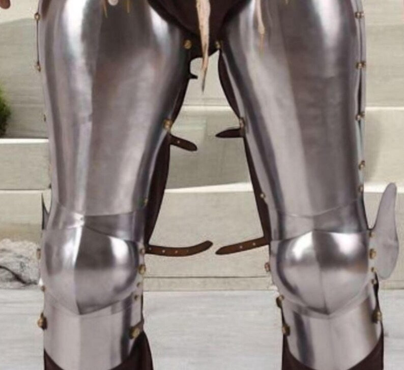 Adjustable leather straps on medieval knight leg armor for secure fit during LARP events
