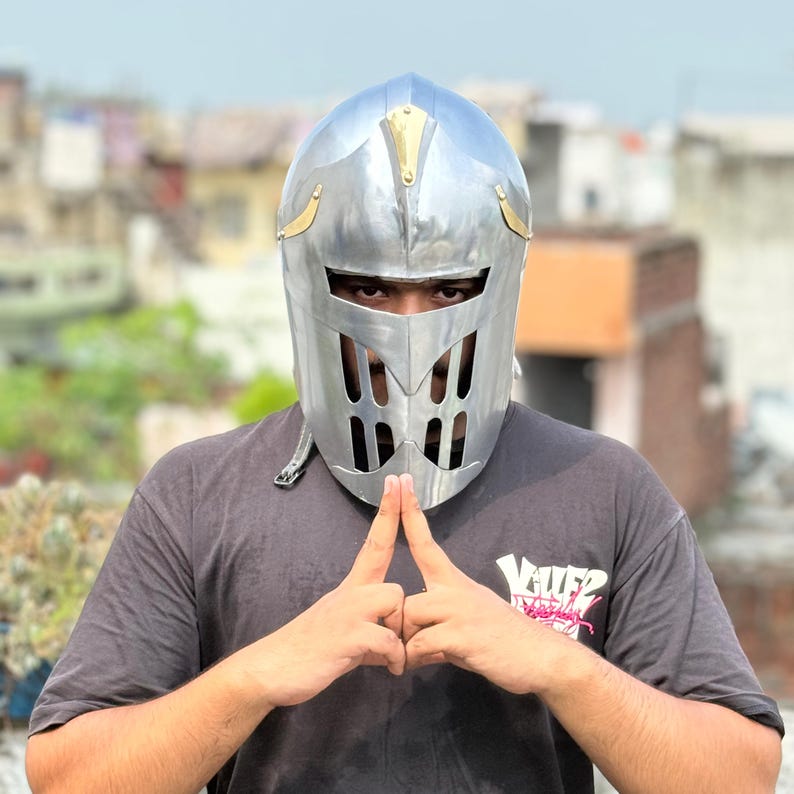 Close-up of golden accents on Visor of Aegis Prime medieval knight helmet for collectors and LARP enthusiasts