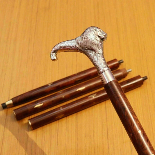 Antique lion head walking stick with brass handle and wooden cane