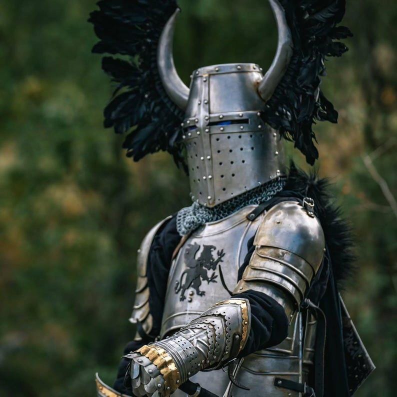  Close-up of crusader helmet with black plumes and metal horns