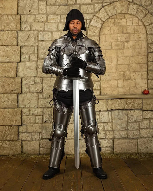 Front view of the Balthasar full body medieval knight armor suit in polished steel, handcrafted and fully wearable by Artisans Hub.

