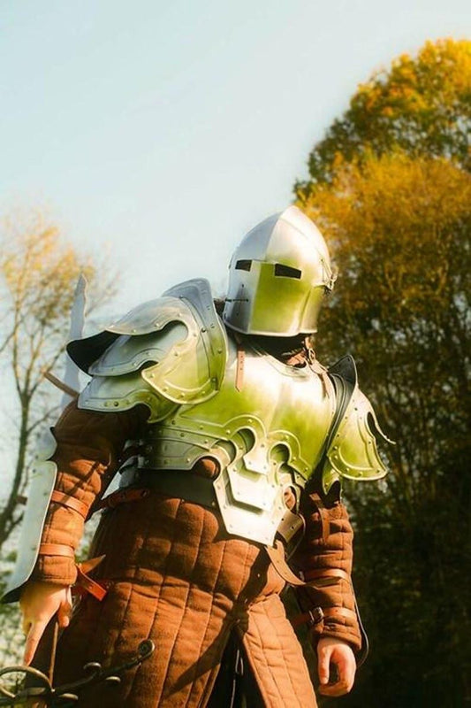 Full view of the Barbuta Knight medieval armor suit displayed upright, showing the front chest plate, helmet, and leg guards.

