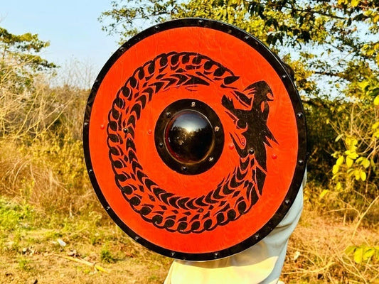 Side angle of handcrafted Viking battle-ready red shield for costumes and reenactments