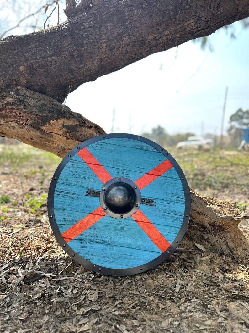Battleworn Viking shield with authentic-looking wooden Norse mythology details for Valhalla cosplay