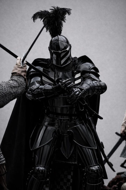 Black Crusader knight full body armor Person in dark medieval armor with a spear on a gray background