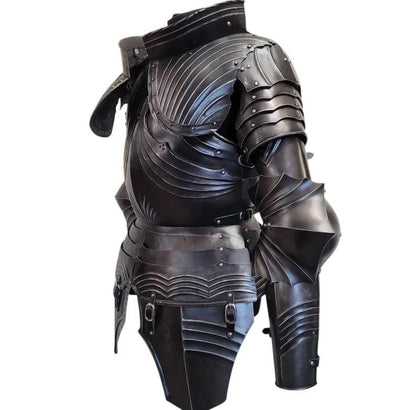 Side view of the full leg armor with greaves and articulated knee plates, showcasing adjustable leather straps and gothic styling.

