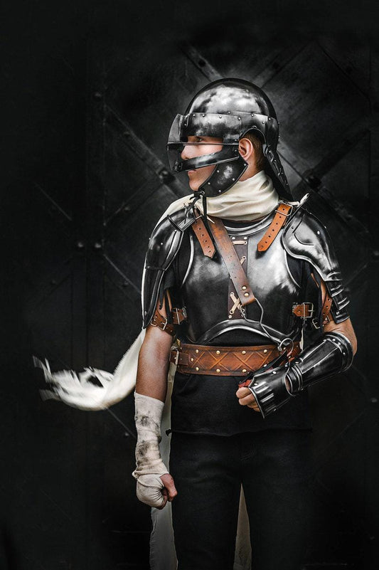 Blackened steel full suit of armor front view – replica of young Guts costume
