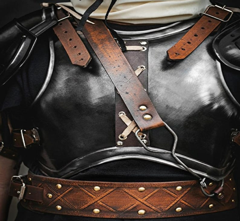 Blackened Steel Guts Armor showing forged shoulder plate details