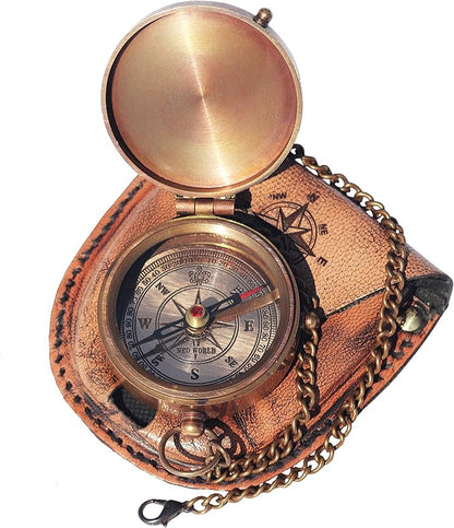 Handcrafted brass compass shown with leather case and brass chain.

