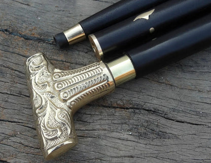 Close-up of brass silver Victorian handle on antique walking stick
