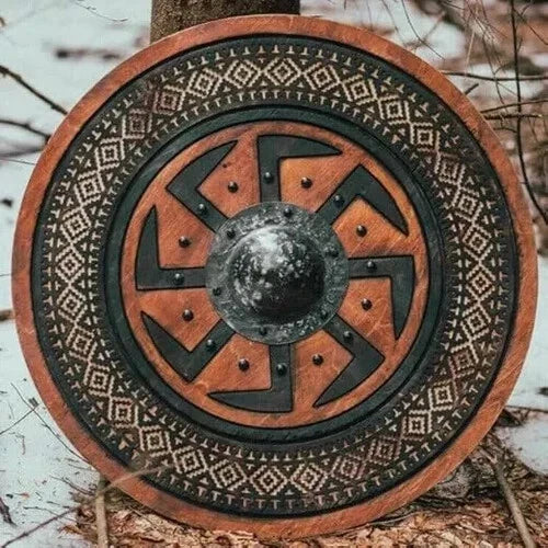 Front view of carved Viking wooden shield with Norse battle design