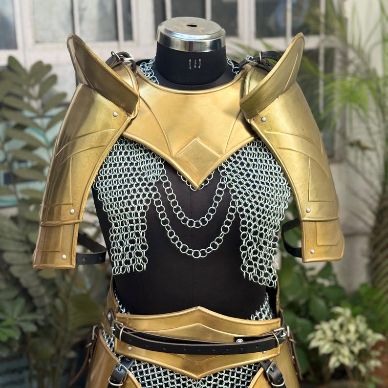 Close-up of Valkyrie Golden Armor chainmail corset with leather straps and steel plates