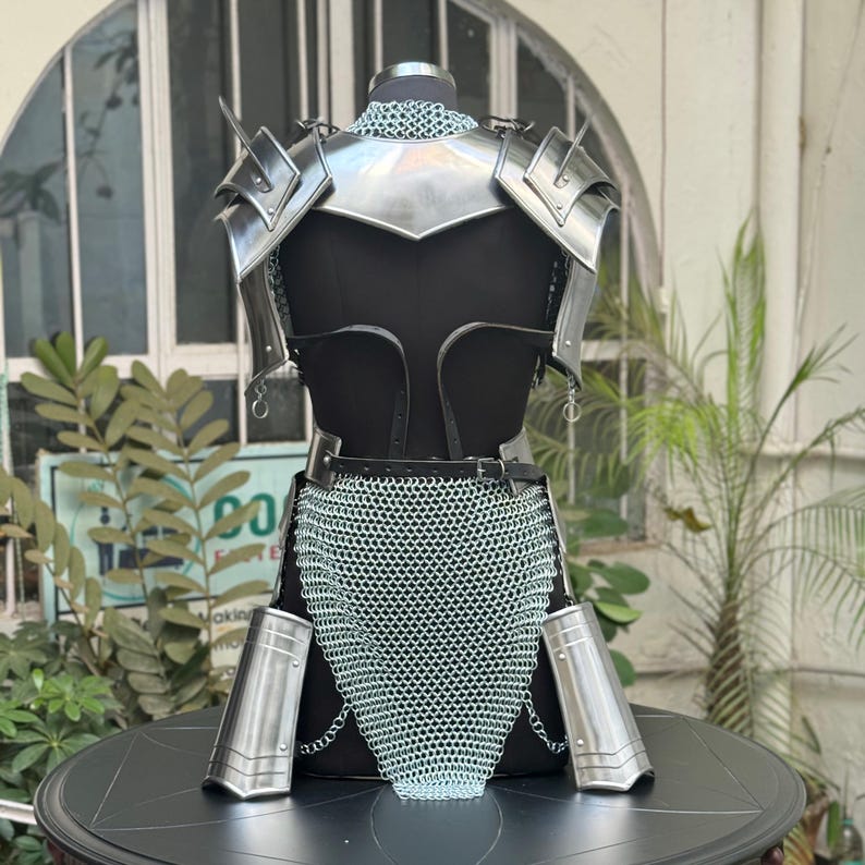 Female warrior wearing Mythic Valkyrie Warplate – epic silver chain and armor ensemble for fantasy cosplay and LARP