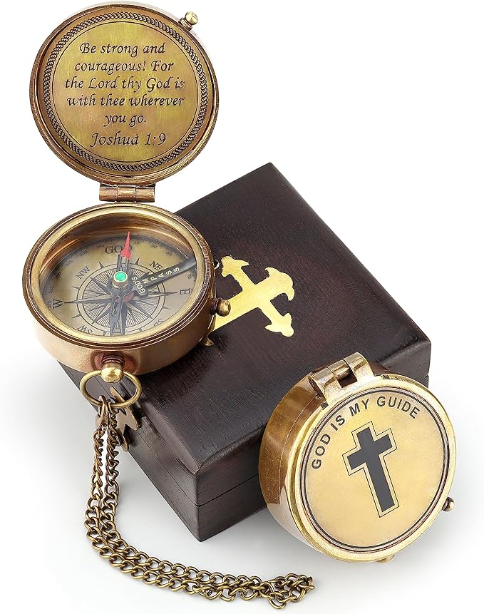 Front view of the engraved brass compass with “God Is My Guide” marked at True North.

