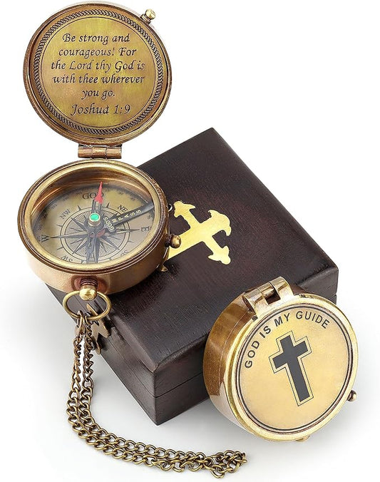 Front view of the engraved brass compass with “God Is My Guide” marked at True North.

