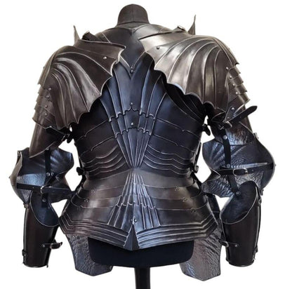 Close-up of black steel gauntlets and flexible chainmail coif included in the gothic armor set, highlighting craftsmanship and texture.

