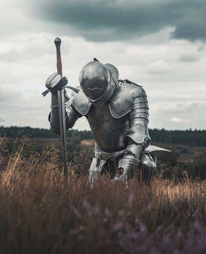 Complete medieval knight armor set with horned helmet and sword included.