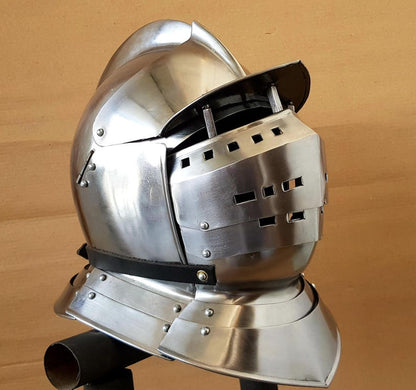 Gothic Knight helmet with hinged visor showing ventilation slits and steel construction