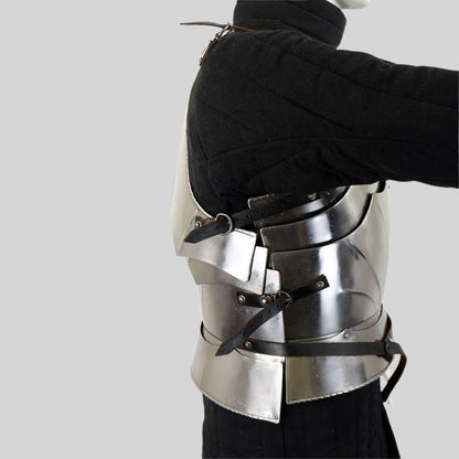 Side angle showing adjustable leather straps on steel Gothic breastplate armor for medieval reenactment.