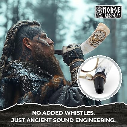 Close-up of hand engraved Viking wolves on authentic ox horn