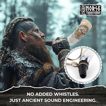 Close-up of hand engraved Viking wolves on authentic ox horn