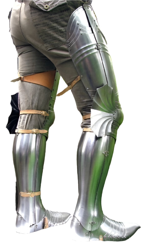 Metallic knee pads worn by a person in a forest setting