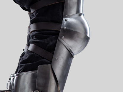 Handmade craftsmanship detail on medieval leg greaves with knee protection