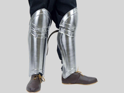 Handmade Polished Steel Knight Greaves shown as part of full medieval armor set