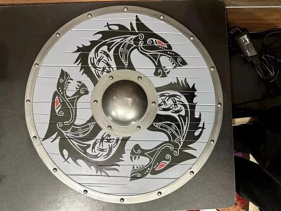 Decorative Viking wooden shield displayed on wall for home or office use