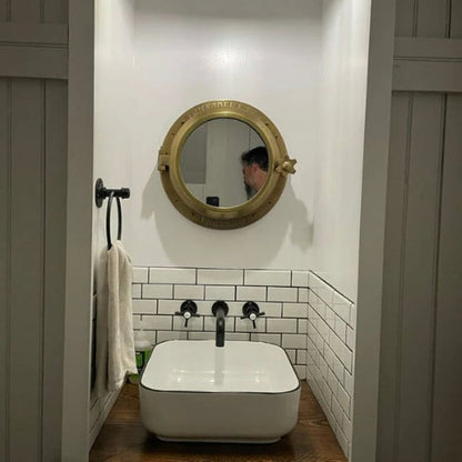 Heavy canal boat porthole mirror showing open and closed position